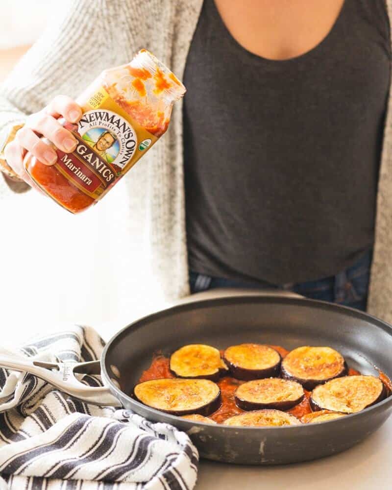 Pouring tomato sauce