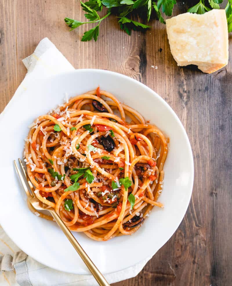 vegetarian pasta in white bowl with fork