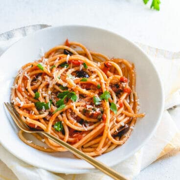 vegetarian pasta in white bowl with fork