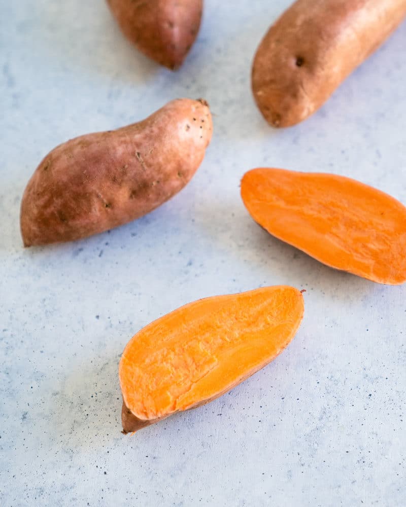 Step 1: Slice the sweet potatoes in half.