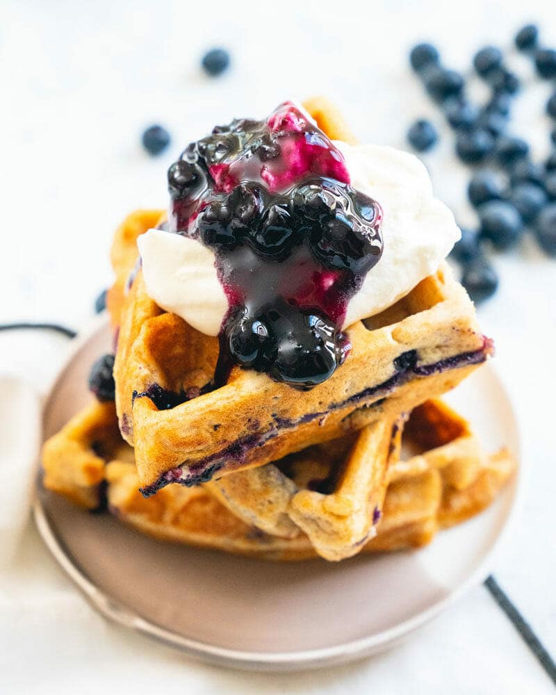 Bourbon infused alcoholic whipped cream on waffles