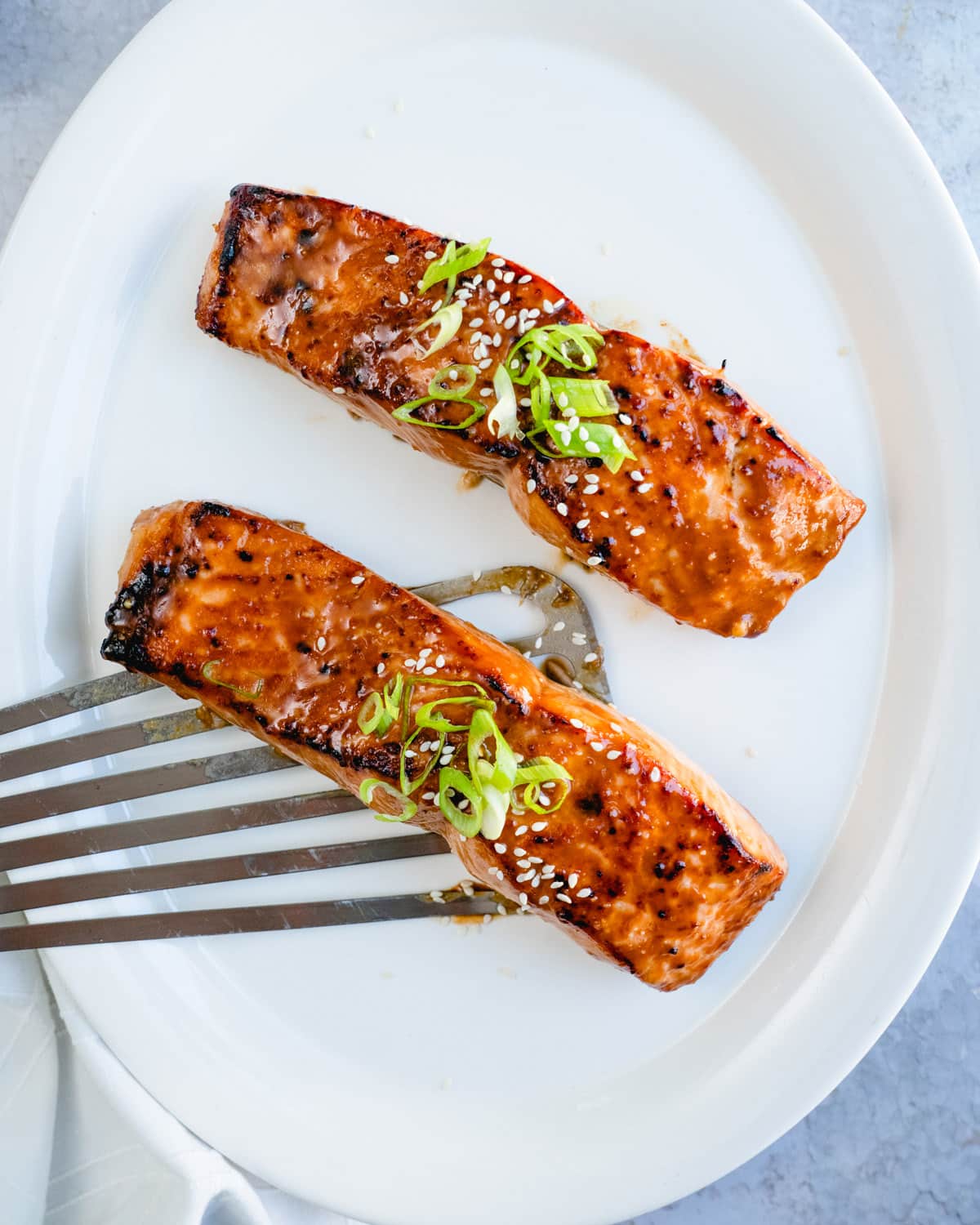 Miso Salmon recipe with green onion garnish.