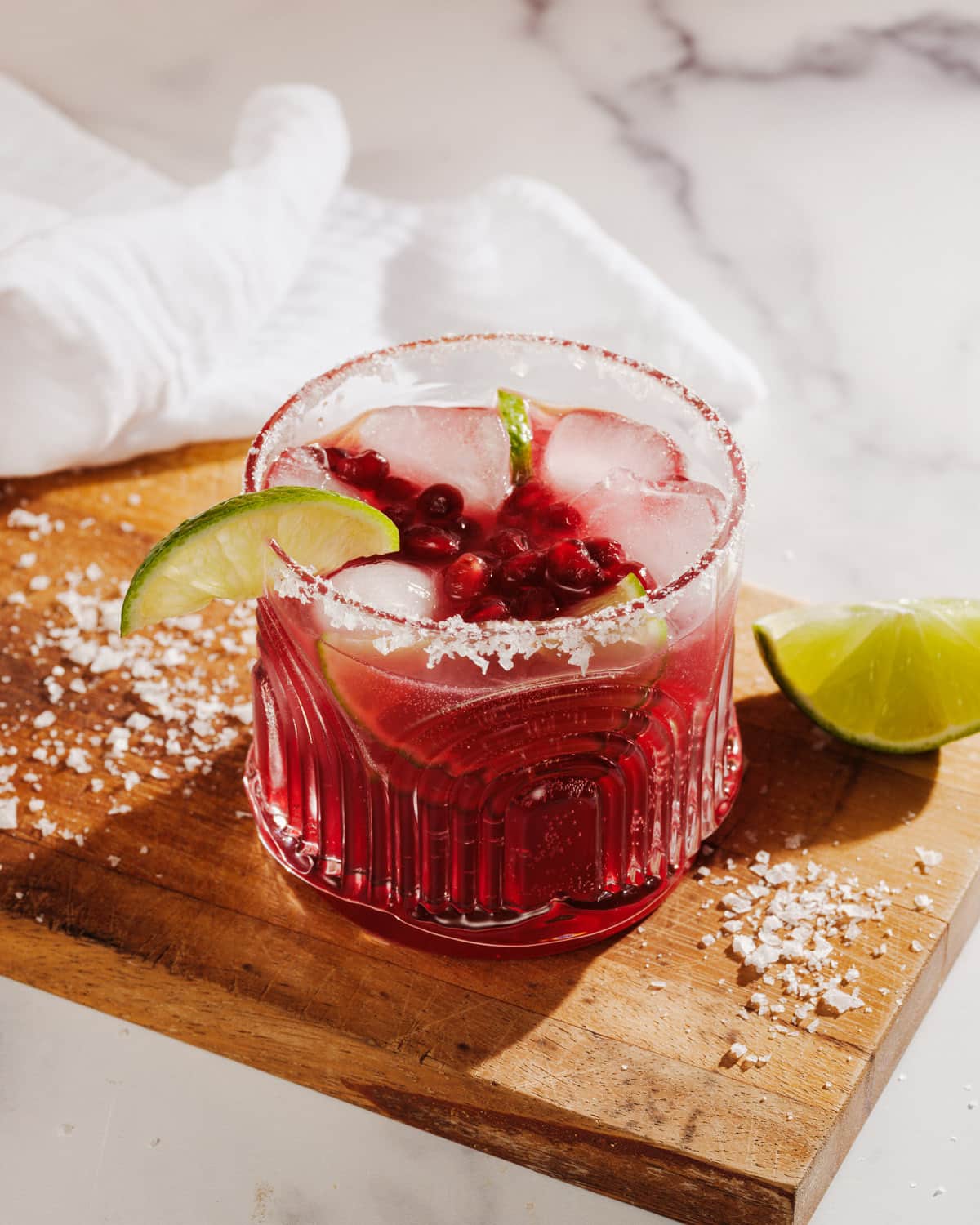 Pomegranate mocktail with lime and salt rim