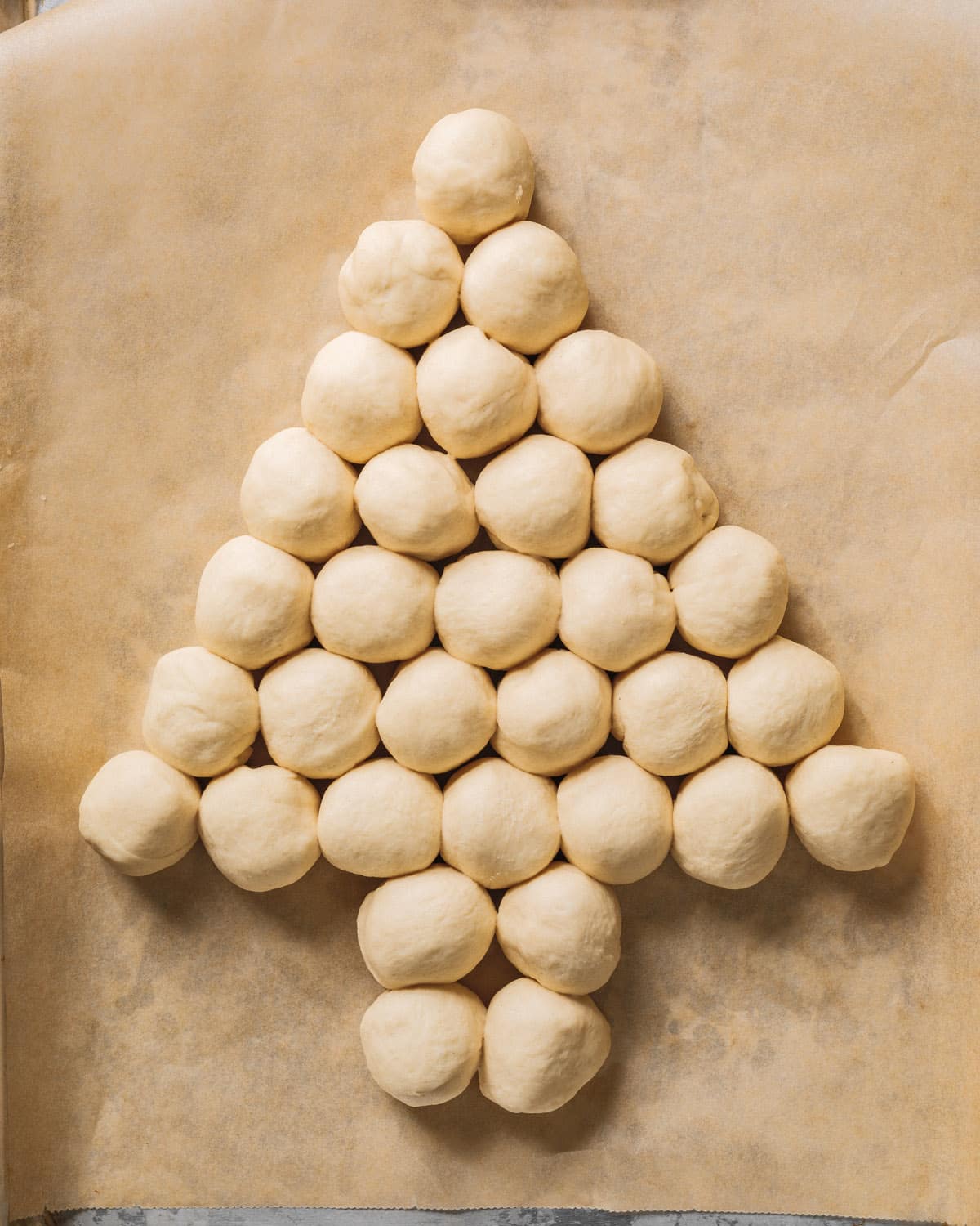 Place the dough balls in a Christmas tree shape