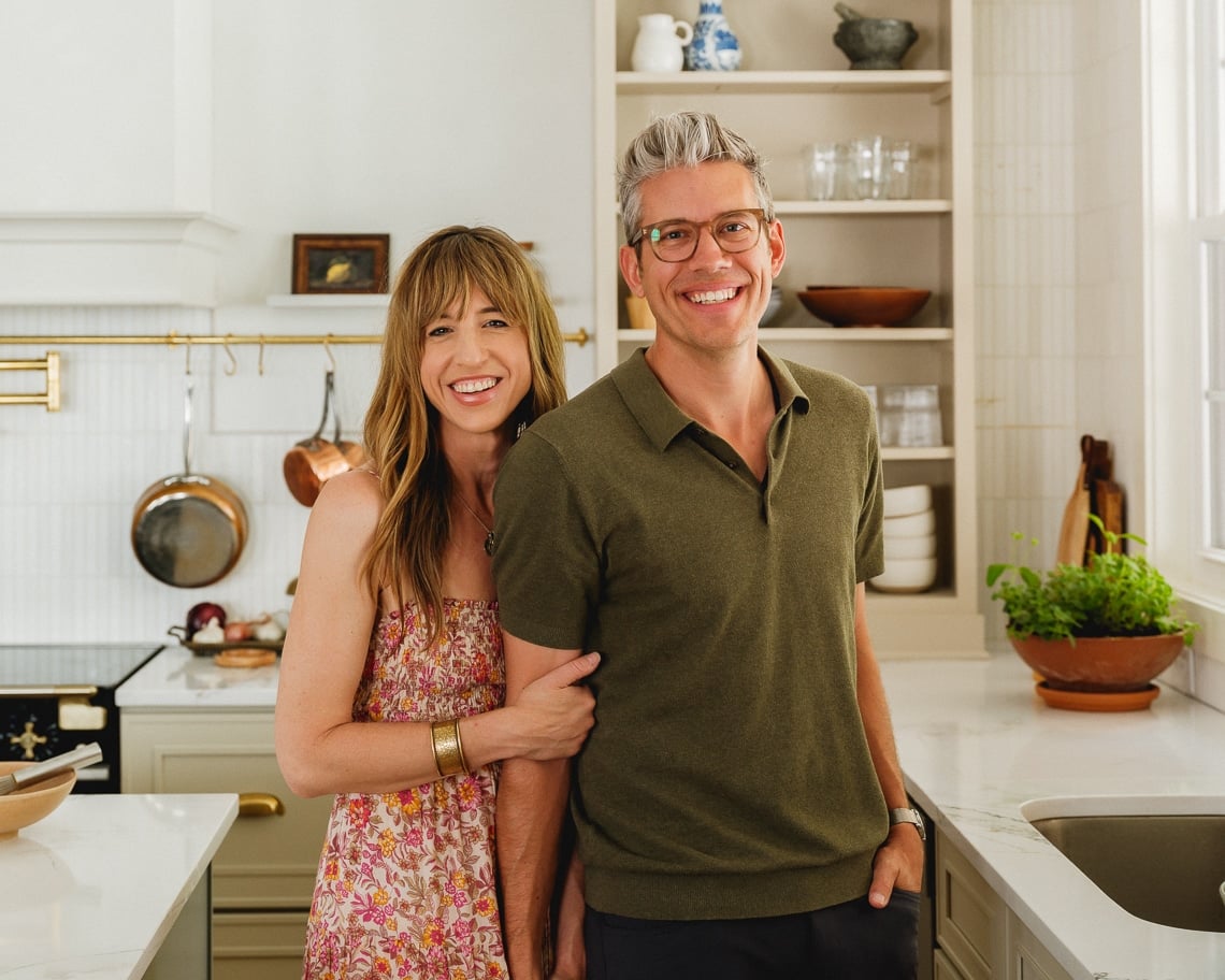 Alex and Sonja Overhiser cooking together in their home kitchen